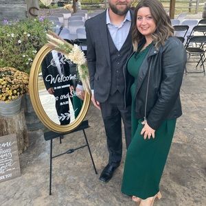 Dark green. Zipper in the back and made with pockets. Worn once